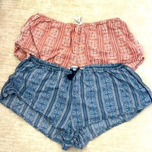 A set of two small Victoria Secret boy shorts in pink and blue